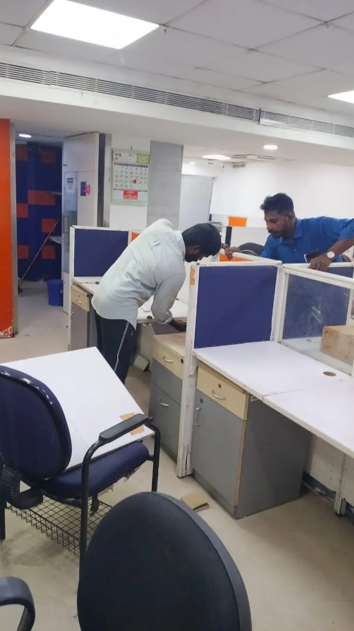 Office workstation cleaning in progress