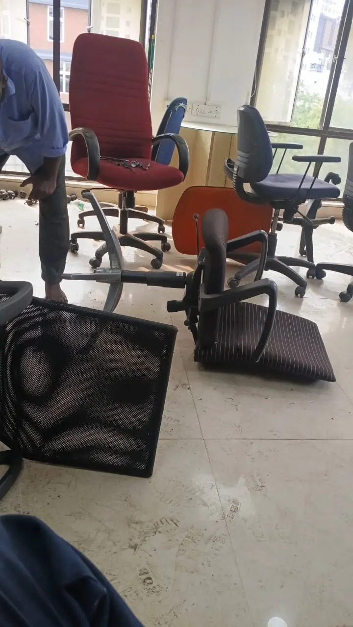 Office chairs prepared for cleaning and repair